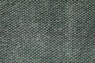Texture of soft grey knitted fabric as background, top view