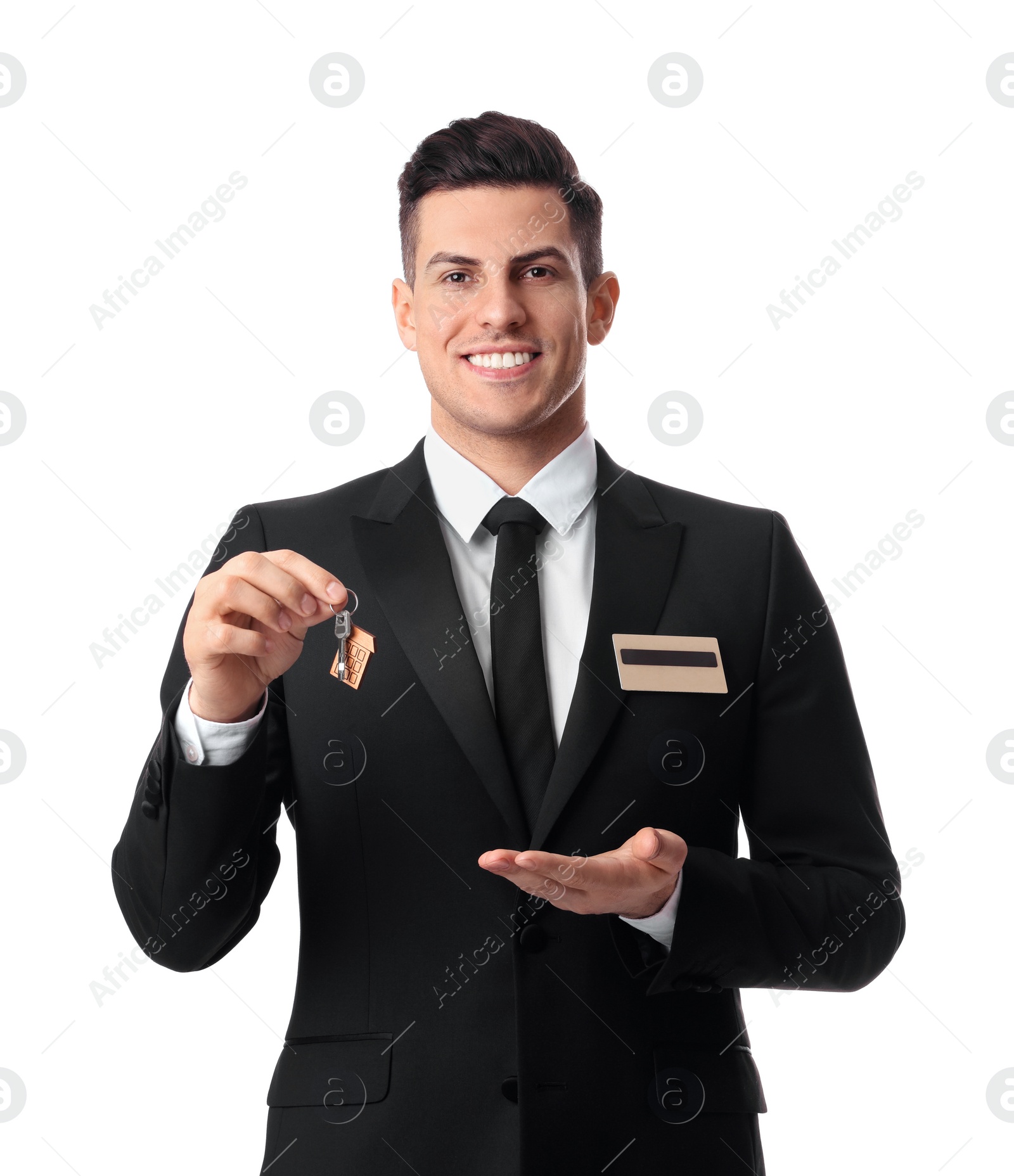 Photo of Happy receptionist in uniform holding key on white background