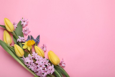 Photo of Beautiful bouquet with different flowers on pink background, flat lay. Space for text