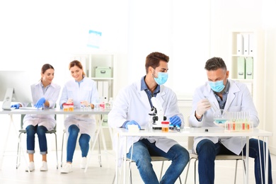 Photo of Scientists working in laboratory. Research and analysis