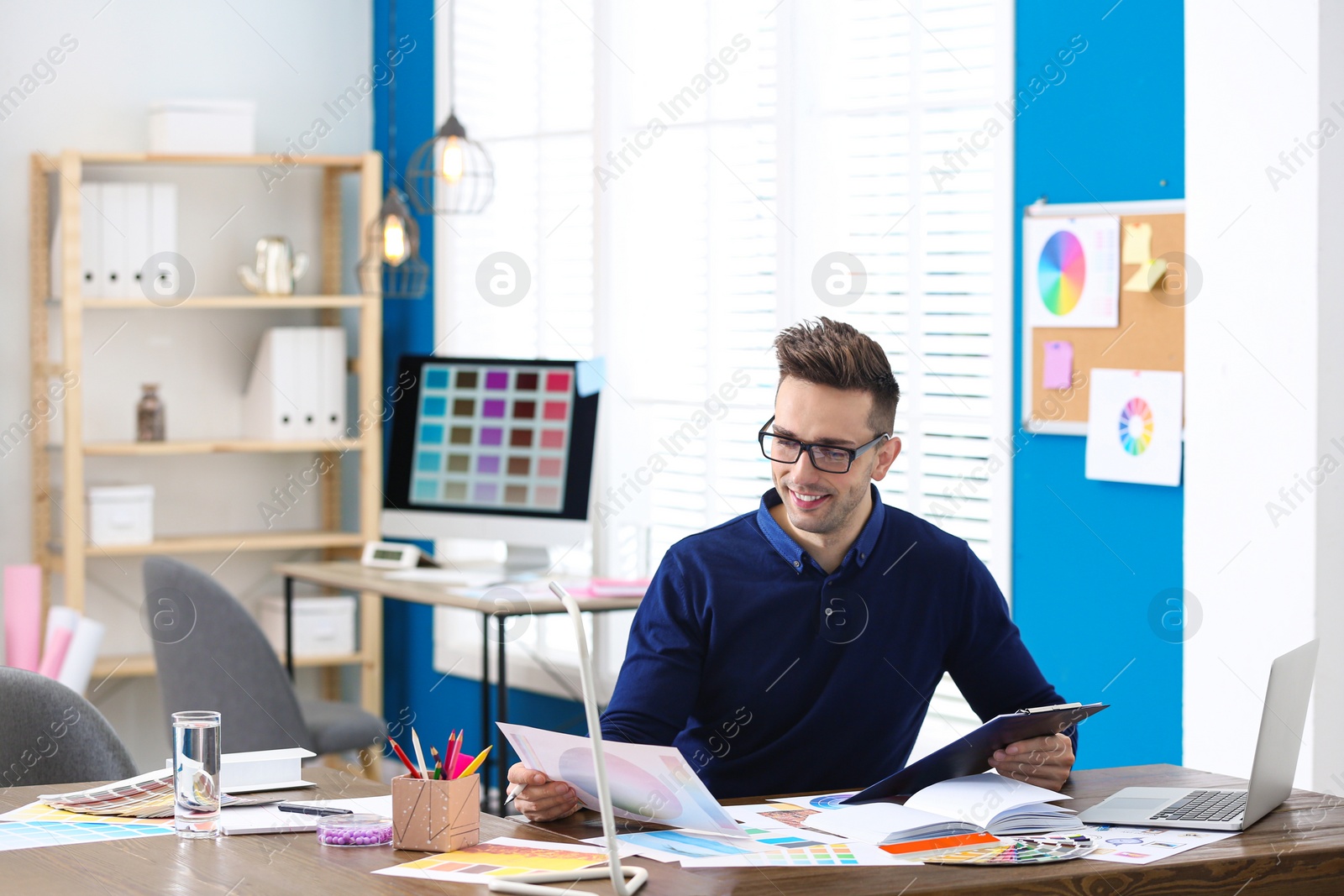 Photo of Professional interior designer at workplace in office