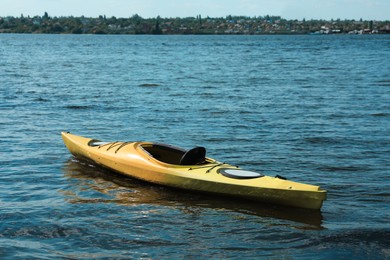 Photo of Modern kayak on river. Summer camp activity