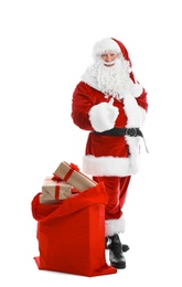 Photo of Authentic Santa Claus with red bag full of gifts on white background