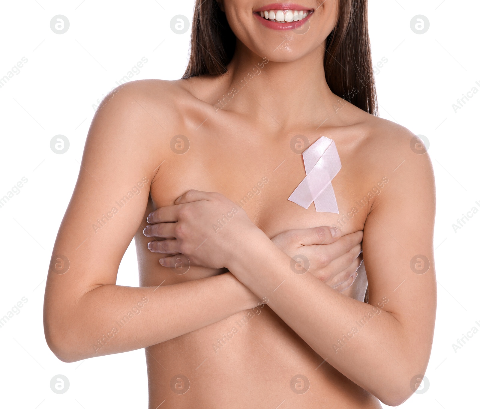 Photo of Naked woman with silk ribbon on white background, closeup. Breast cancer awareness concept