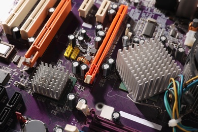 Photo of Computer motherboard as background, closeup. Electronic device