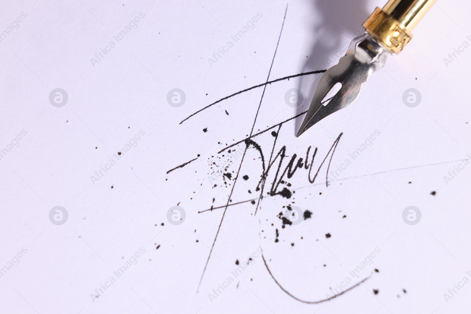 Photo of Signing on sheet of paper with fountain pen, closeup