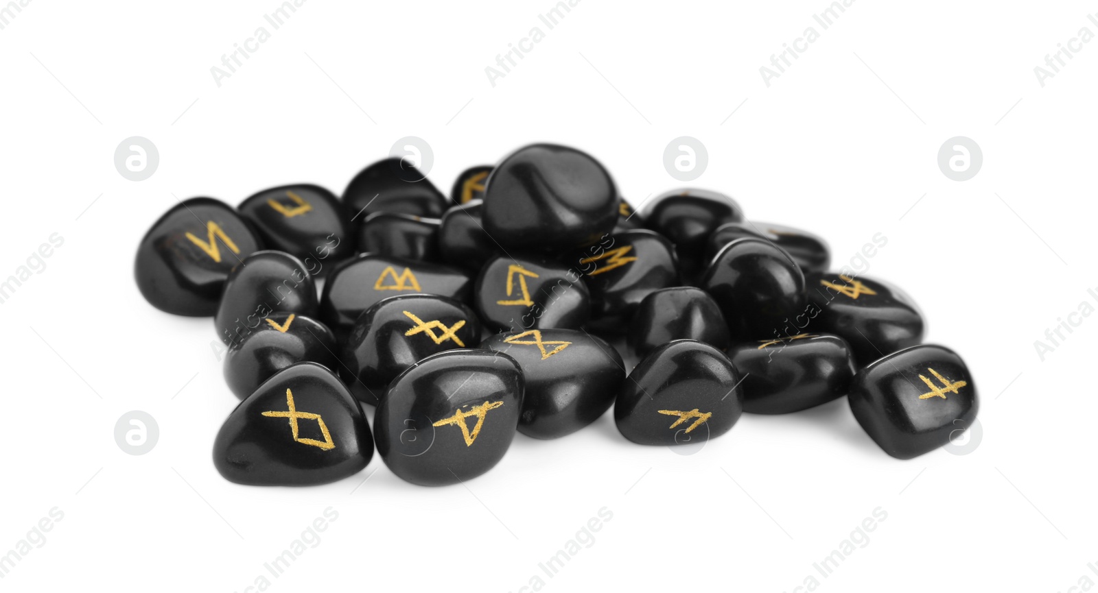 Photo of Pile of black rune stones isolated on white