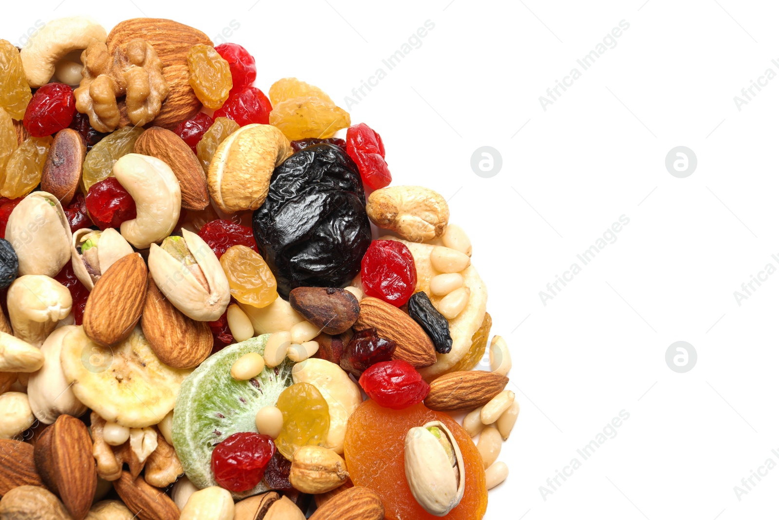 Photo of Different dried fruits and nuts on white background, closeup. Space for text