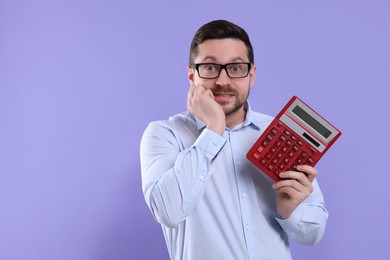 Emotional accountant with calculator on violet background. Space for text