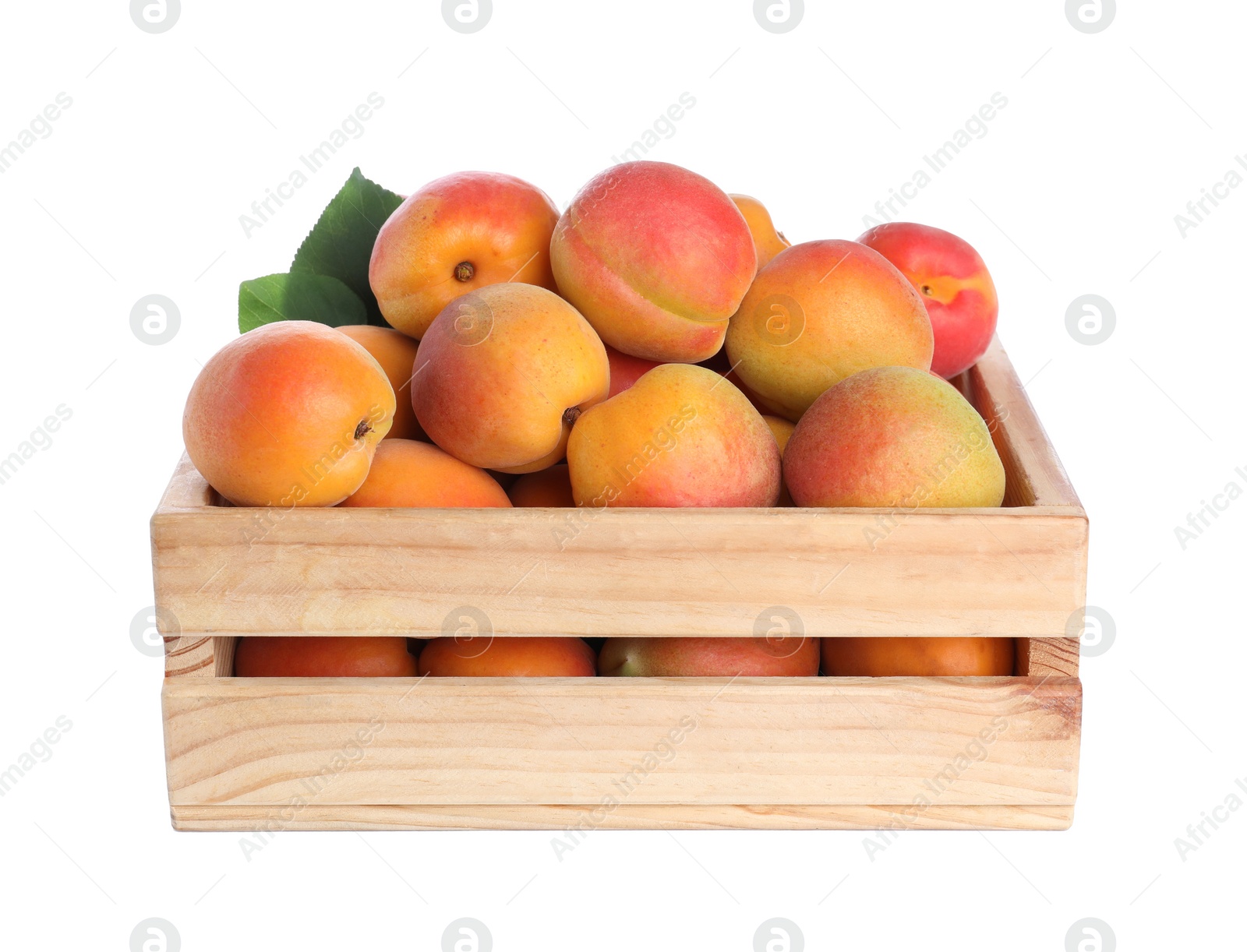 Photo of Delicious ripe apricots in wooden crate isolated on white