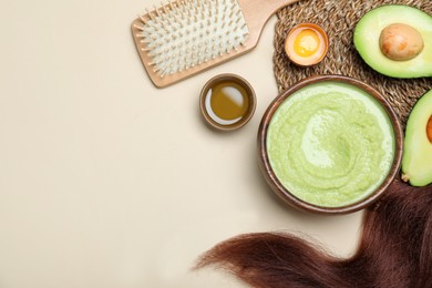Flat lay composition with homemade hair mask and ingredients on beige background. Space for text