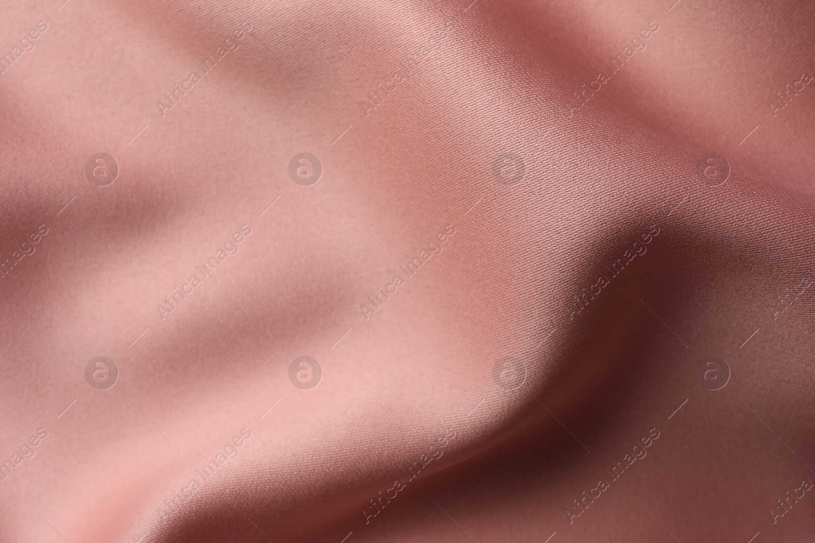 Photo of Texture of pink silk fabric as background, closeup