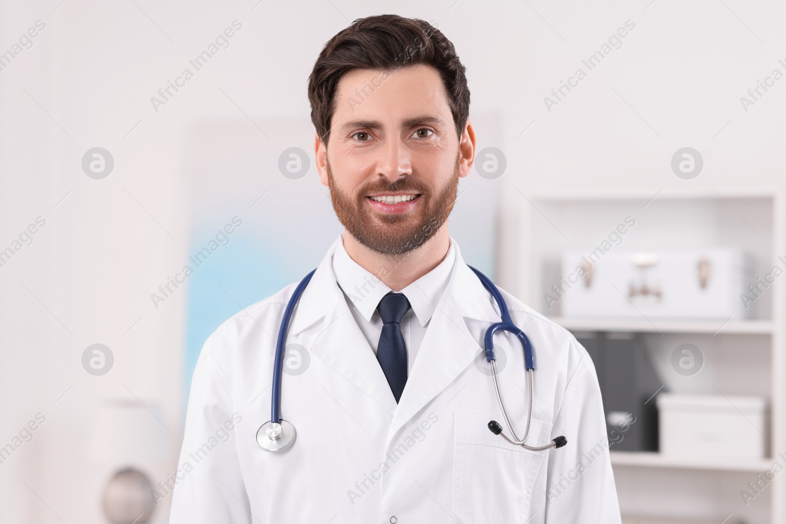 Photo of Portrait of medical consultant with stethoscope in clinic