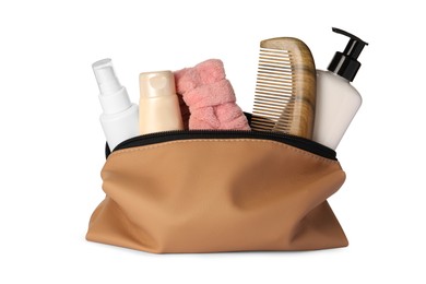 Photo of Preparation for spa. Compact toiletry bag with different cosmetic products isolated on white