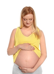 Beautiful pregnant woman showing her tummy on white background