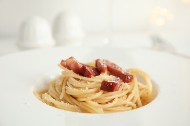 Photo of Delicious Carbonara pasta in plate, closeup view