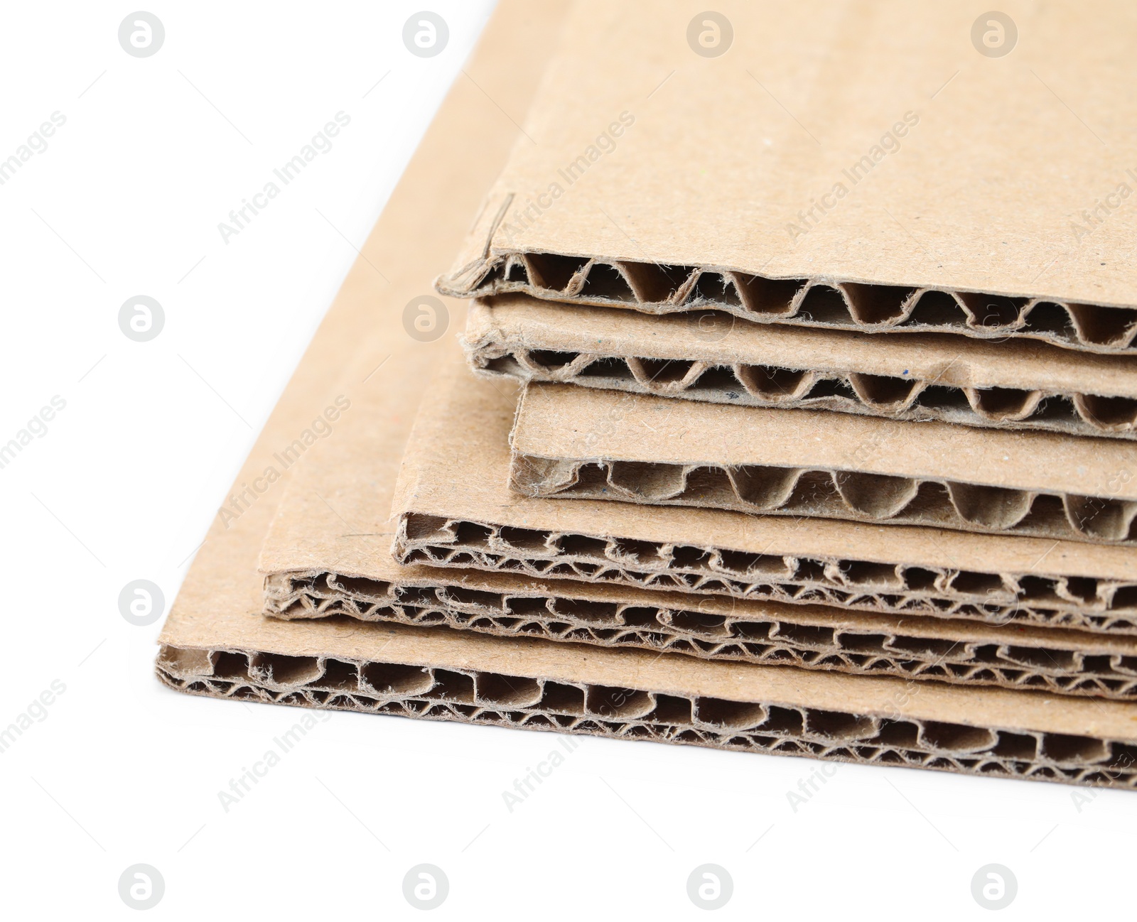 Photo of Sheets of brown corrugated cardboard isolated on white