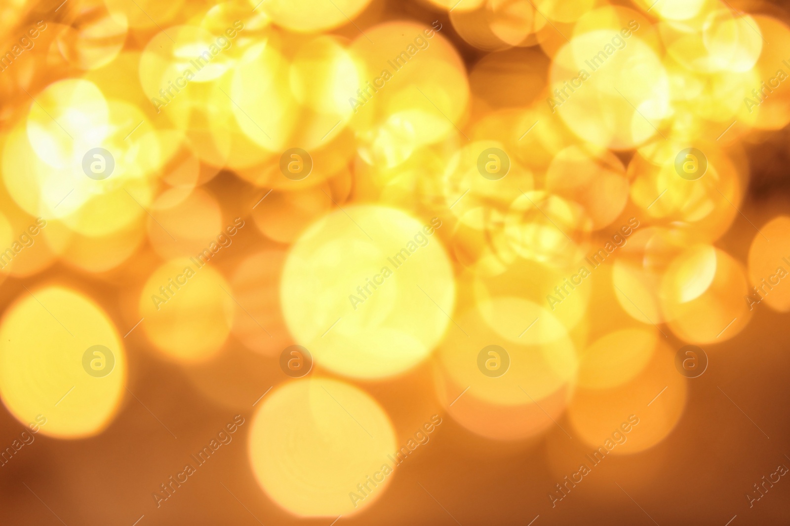 Photo of Gold glitter with bokeh effect as background