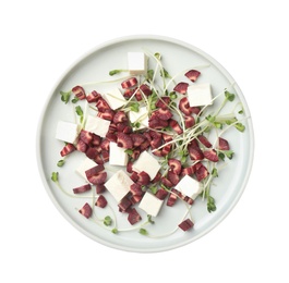 Photo of Delicious fresh carrot salad with feta cheese isolated on white, top view