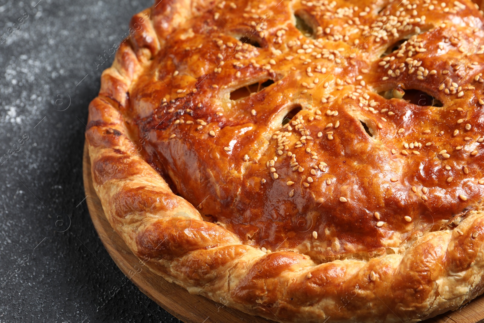 Photo of Tasty homemade pie on grey table, closeup