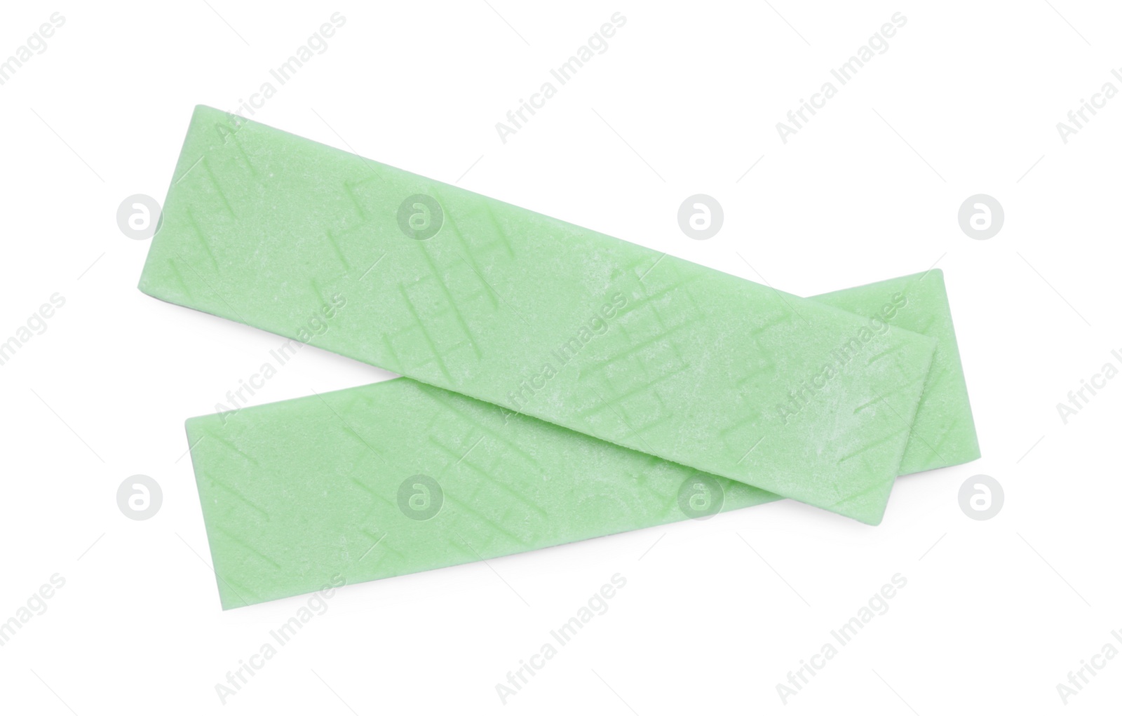 Photo of Sticks of tasty green bubble gums isolated on white, top view