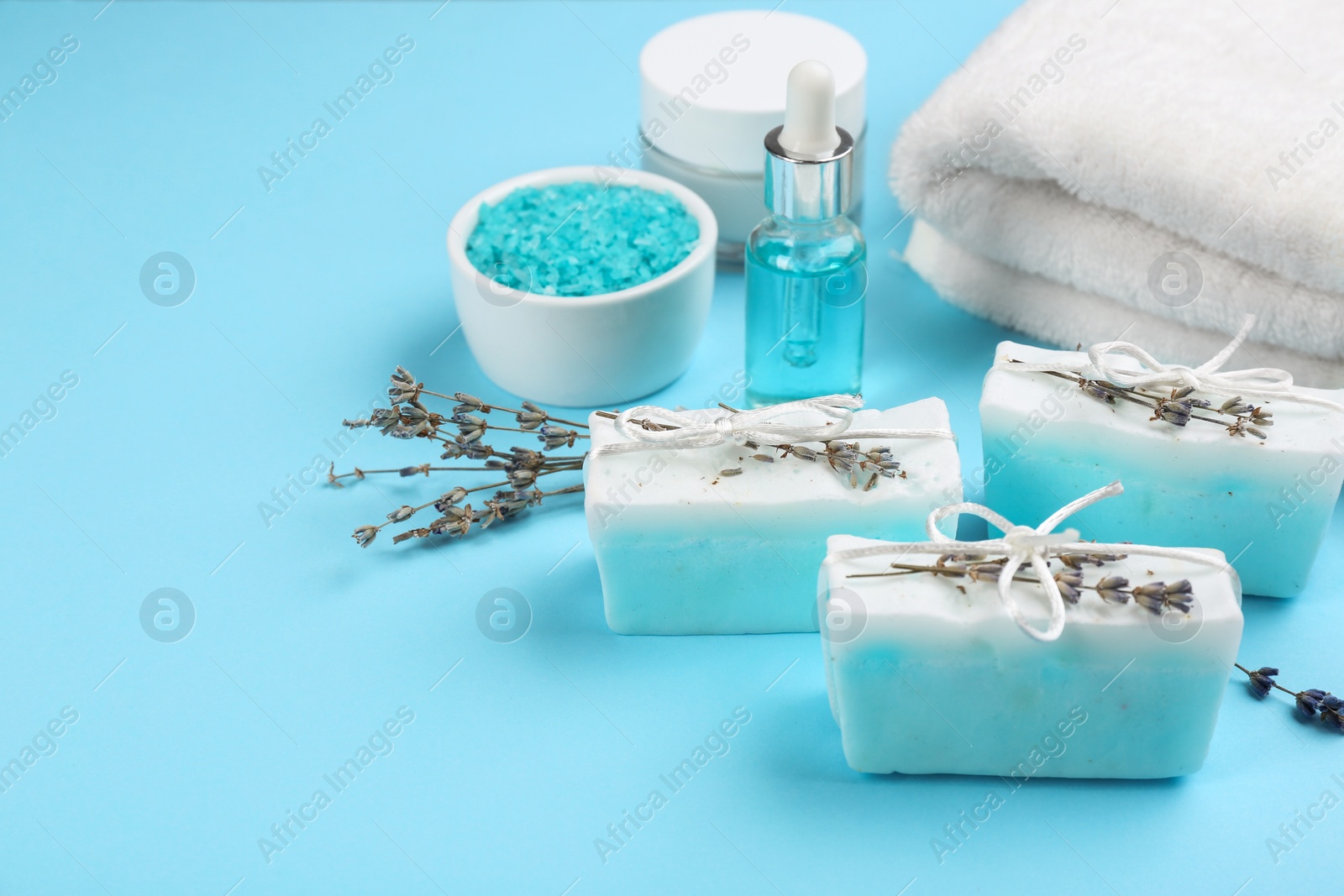Photo of Natural handmade soap bars on light blue background