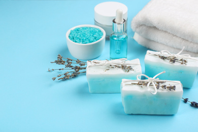 Natural handmade soap bars on light blue background