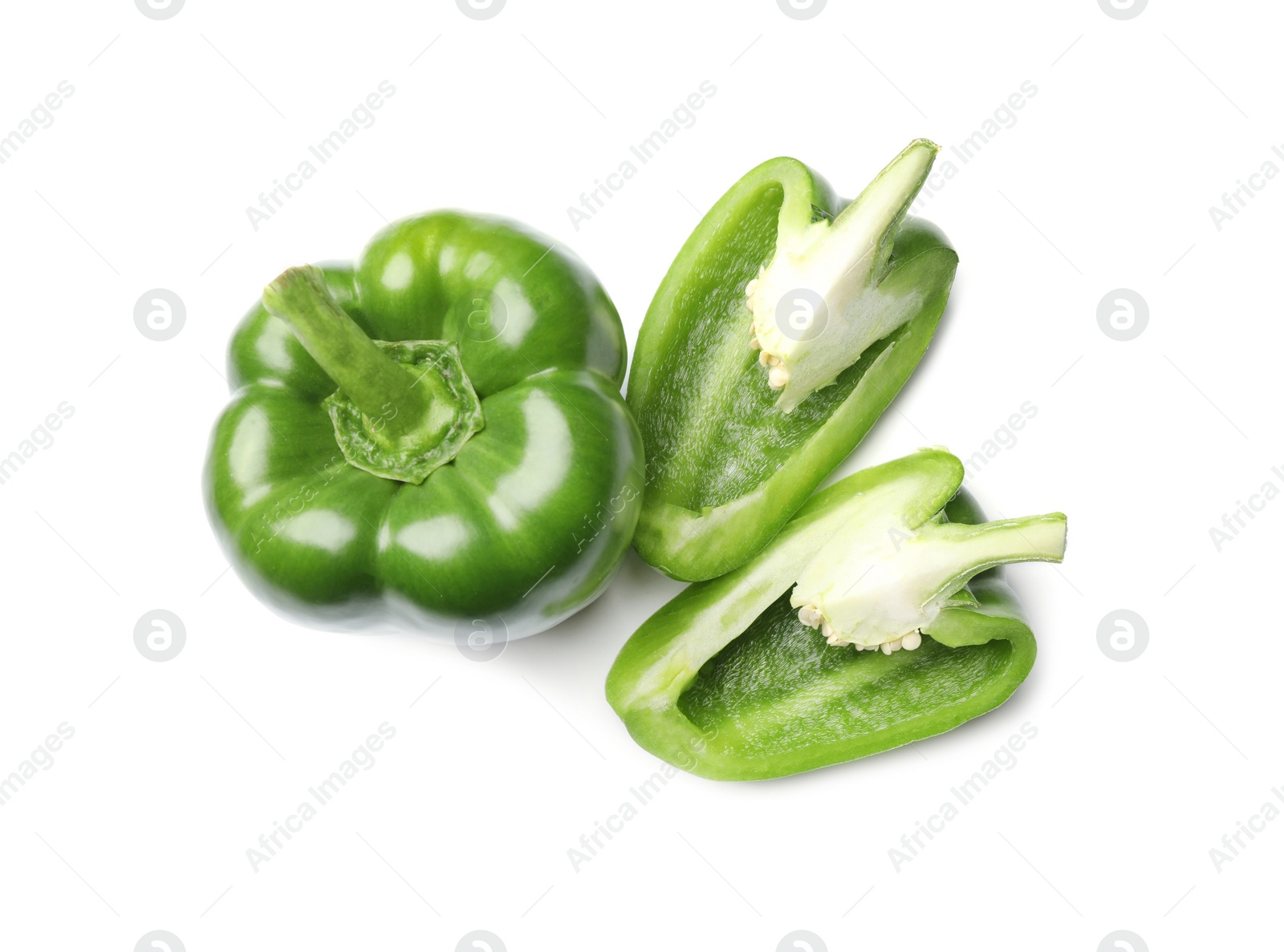 Photo of Whole and cut green bell peppers on white background, top view