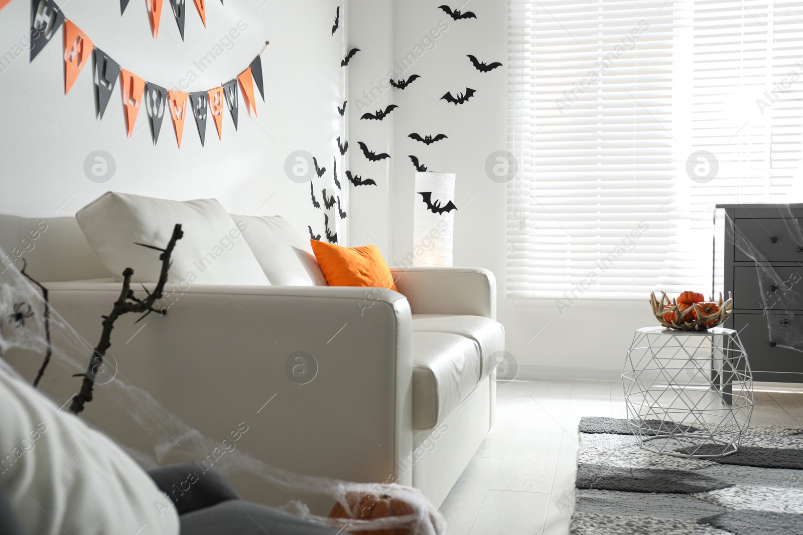 Photo of Modern room decorated for Halloween. Festive interior