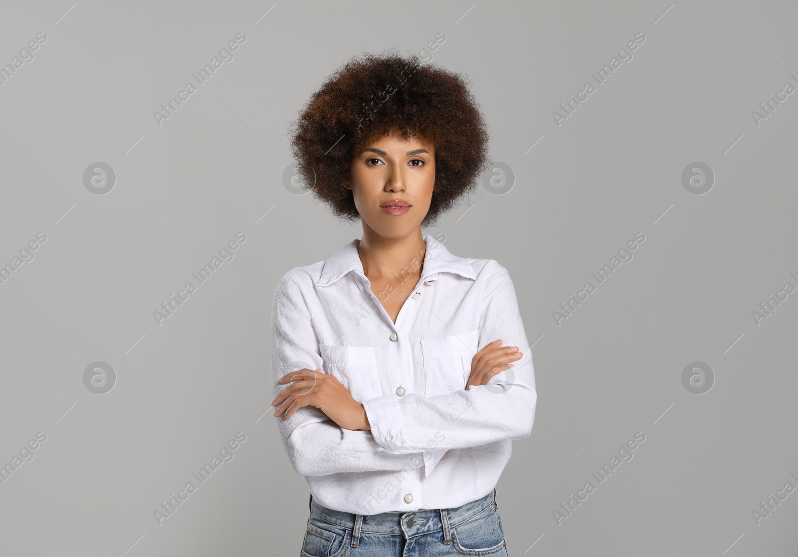 Photo of Portrait of beautiful young woman on grey background