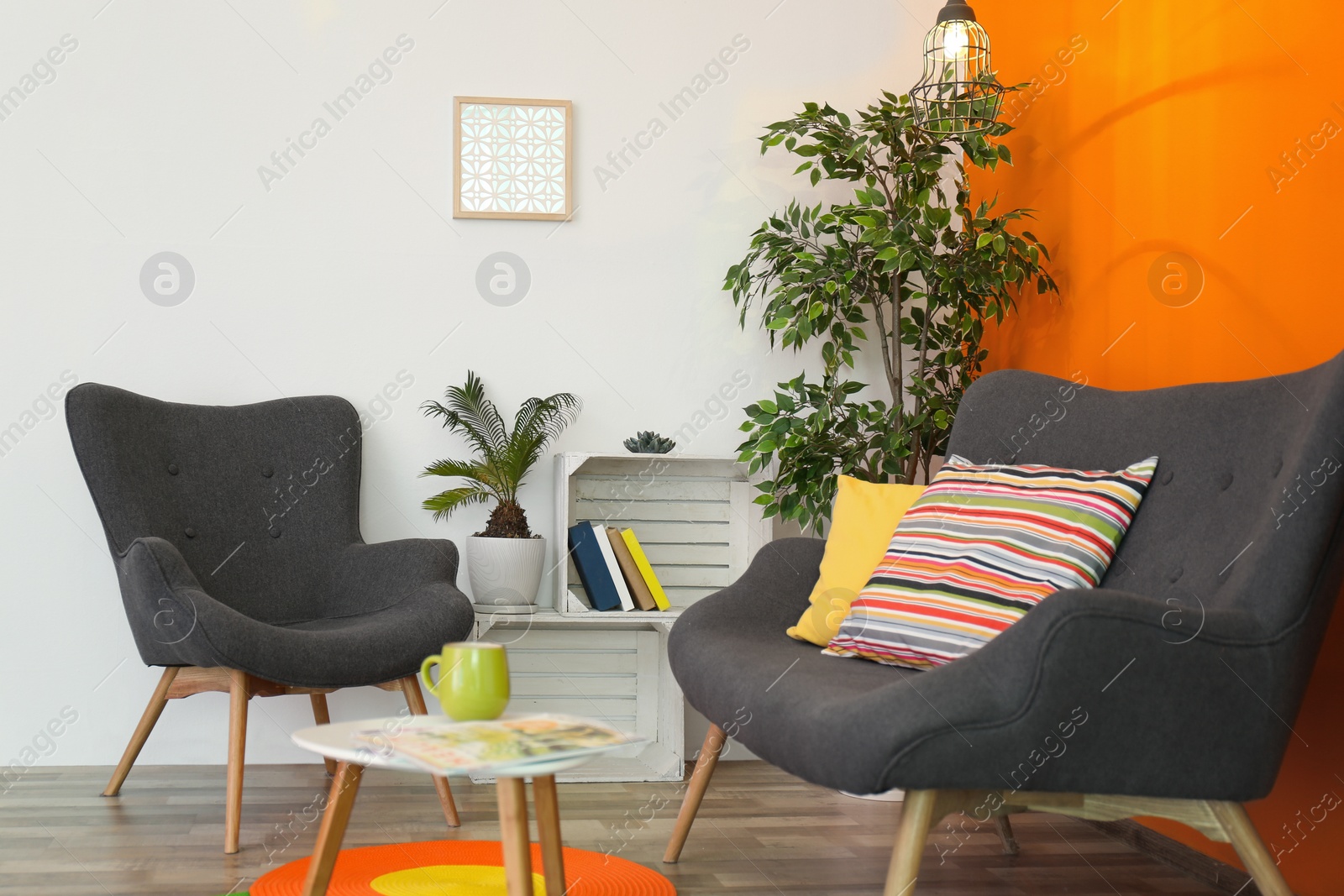 Photo of Interior of modern living room with pillows on sofa