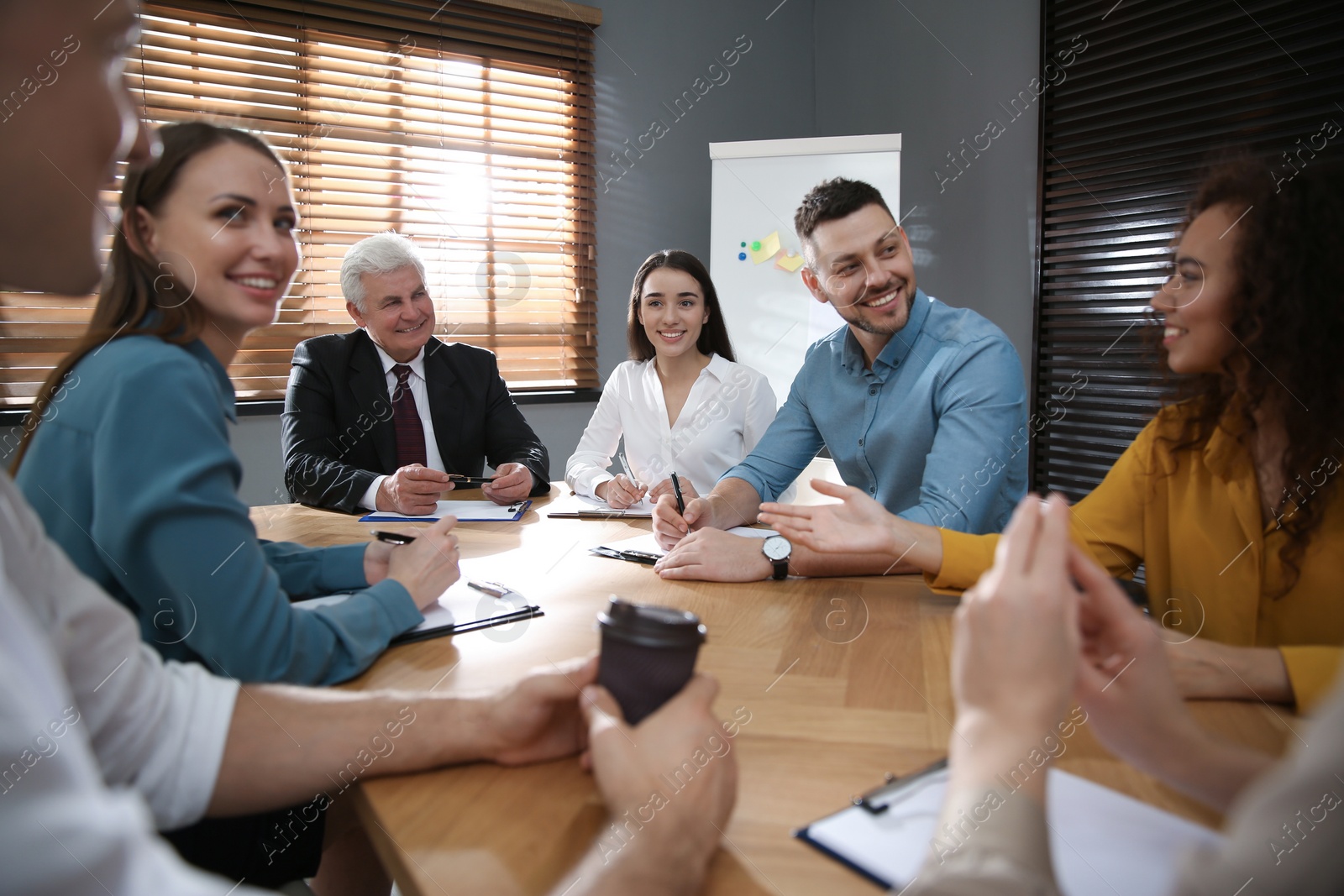 Photo of Group of people discussing questions at business seminar