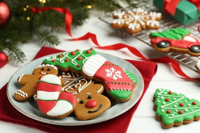 Tasty homemade Christmas cookies on white wooden table