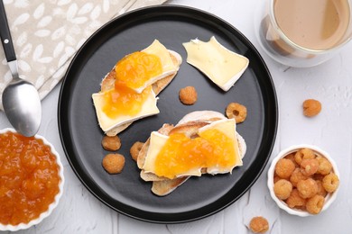 Tasty brie cheese sandwiches on white textured table, flat lay