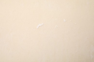 Photo of Raw puff pastry dough as background, top view