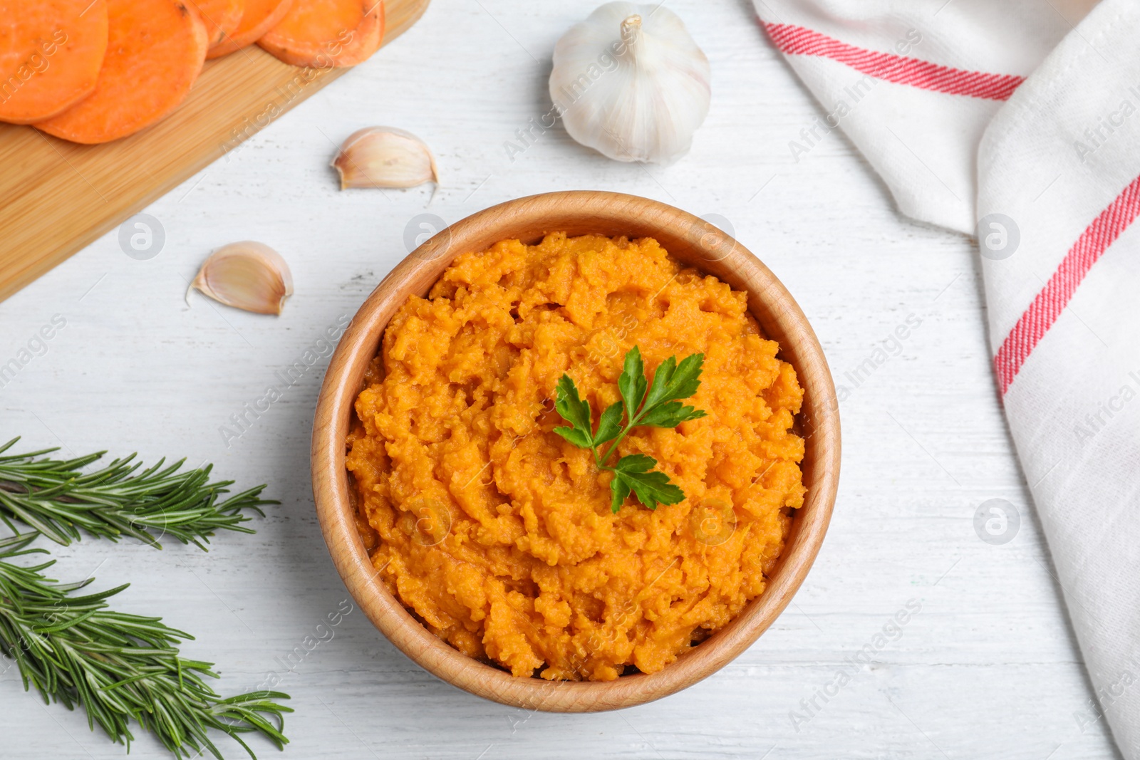 Photo of Flat lay composition with mashed sweet potatoes on wooden background