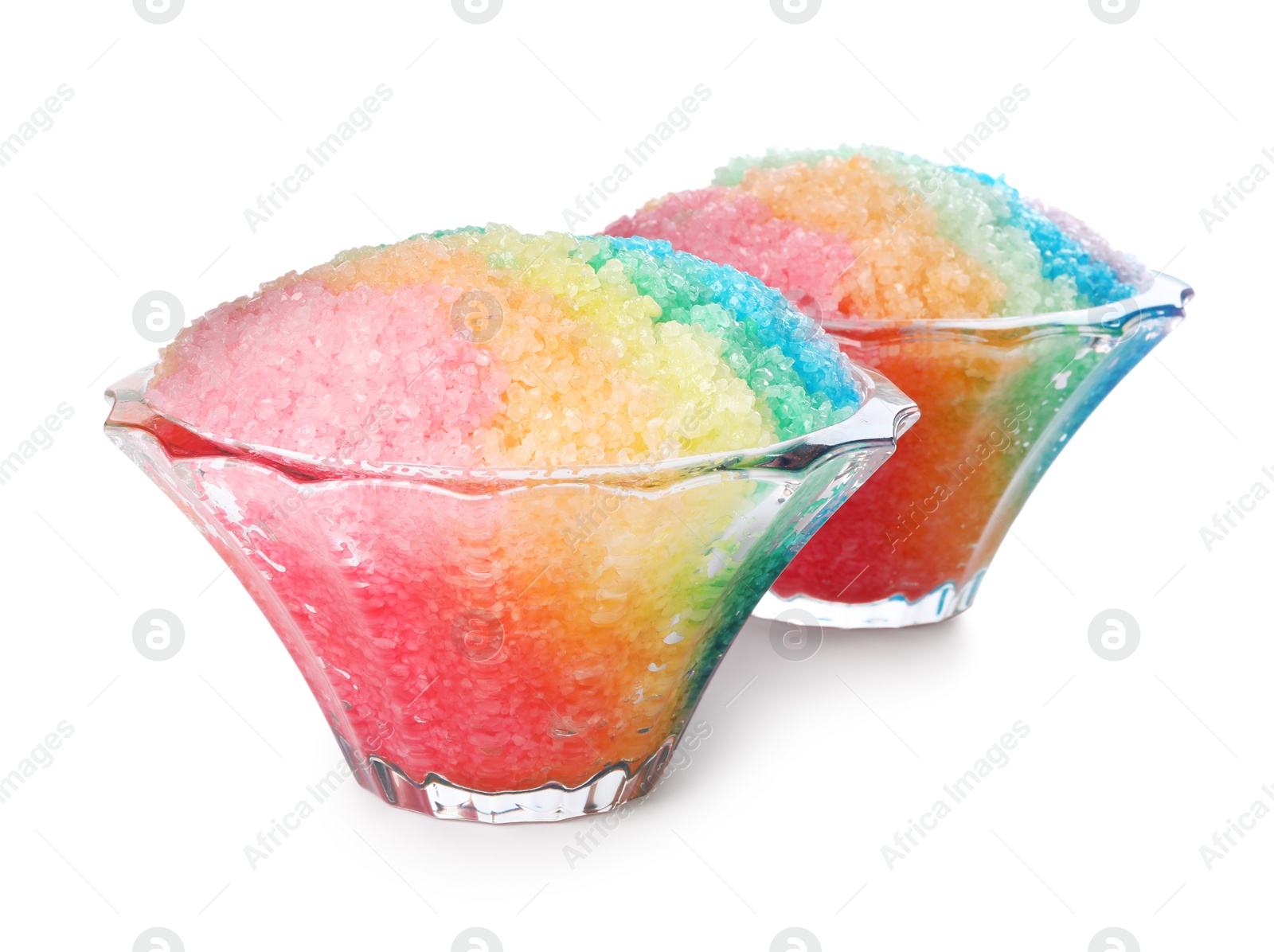 Photo of Rainbow shaving ice in glass dessert bowls isolated on white