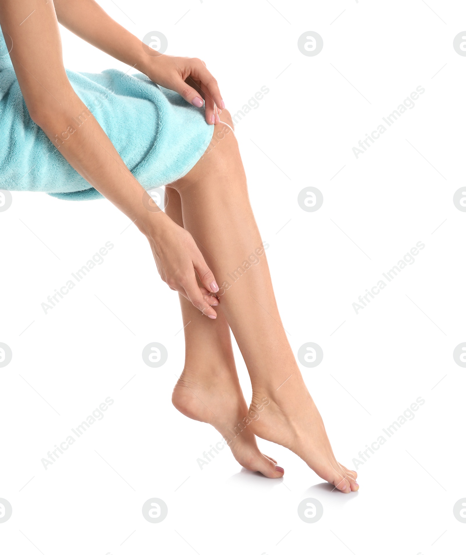 Photo of Woman with beautiful legs and feet on white background, closeup. Spa treatment