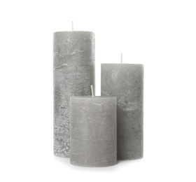 Photo of Three color wax candles on white background