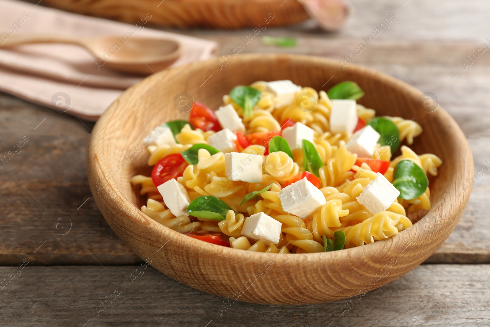 Photo of Plate with delicious pasta primavera on table