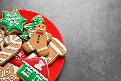 Photo of Tasty homemade Christmas cookies on grey table, top view. Space for text