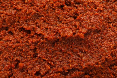 Photo of Texture of delicious adjika sauce as background, closeup