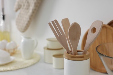 Photo of Set of different utensils on countertop in kitchen, closeup. Space for text