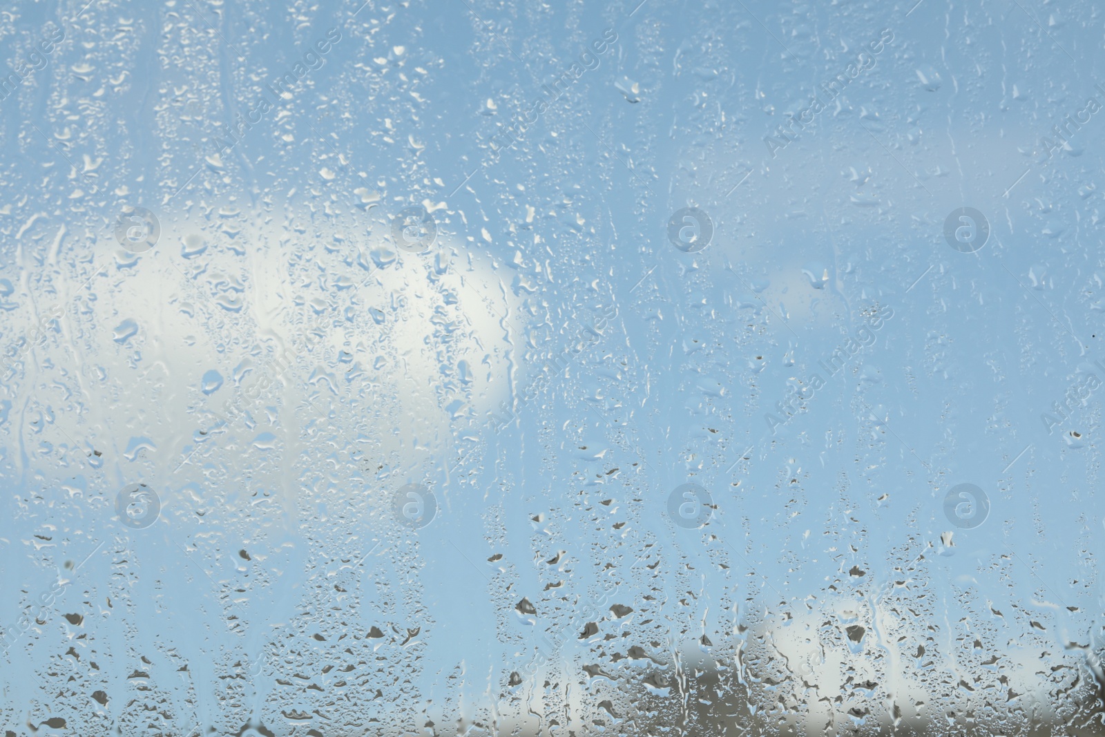 Photo of Window glass with raindrops as background, closeup