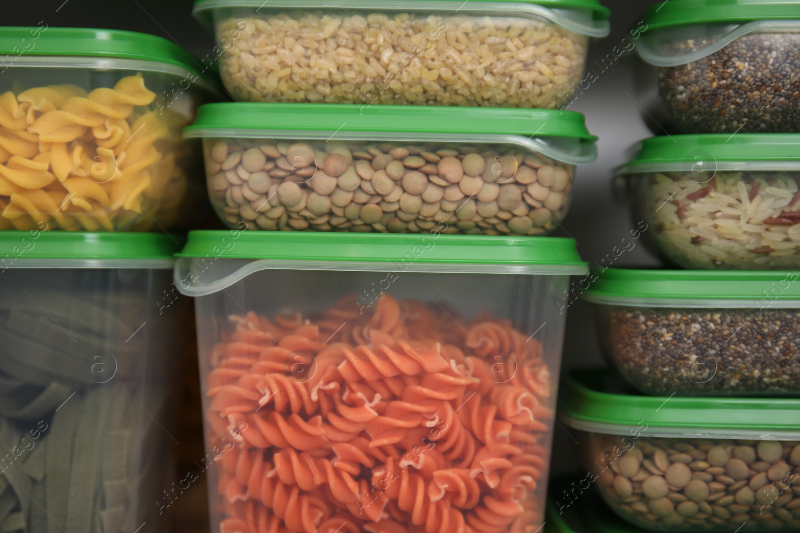 Photo of Plastic containers filled with food products, closeup