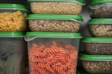 Photo of Plastic containers filled with food products, closeup