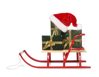 Sleigh with Christmas gifts and Santa hat isolated on white