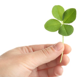 Photo of Woman holding four-leaf clover on white background, closeup