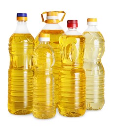 Bottles of cooking oil on white background