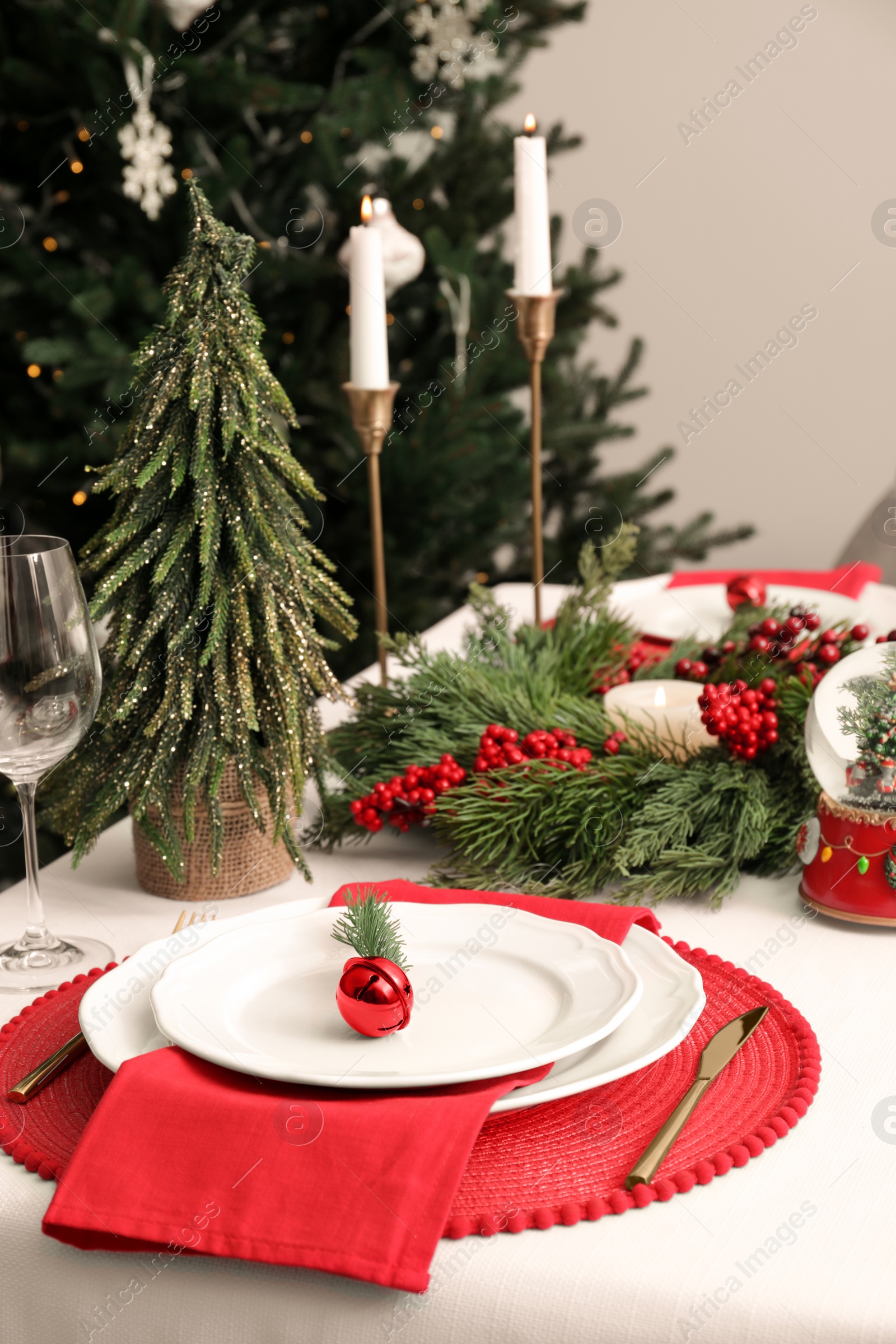 Photo of Luxury place setting with beautiful festive decor for Christmas dinner on white table